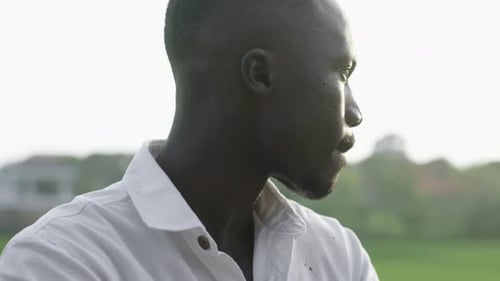 Handsome Man Smiles Outdoors in Natural Light