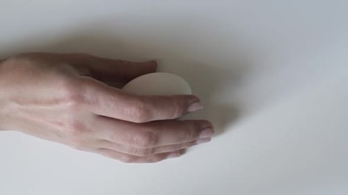 Egg spinning.Chicken Egg Spinning on White Background Top View. Egg Spinning and Rolling on the