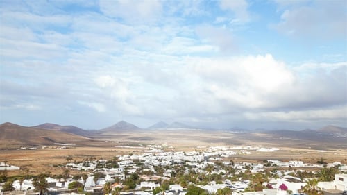 Aerial View of Coastal Town with Mountains