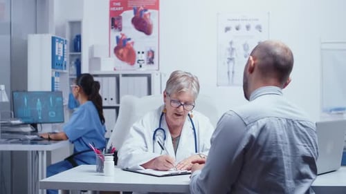 Doctor Consults Patient in Modern Medical Office
