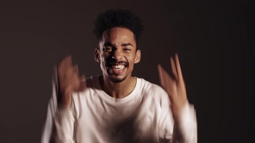Man Yelling Angrily in Studio Setting