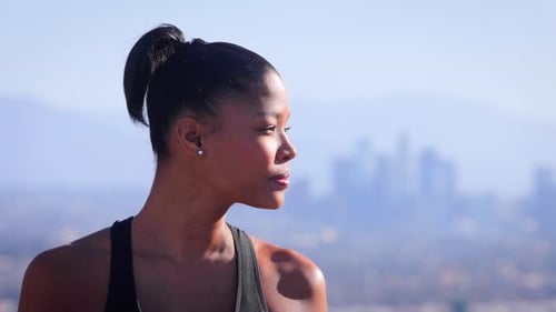 Mixed ethnicity woman Exercising in a park in Los Angeles