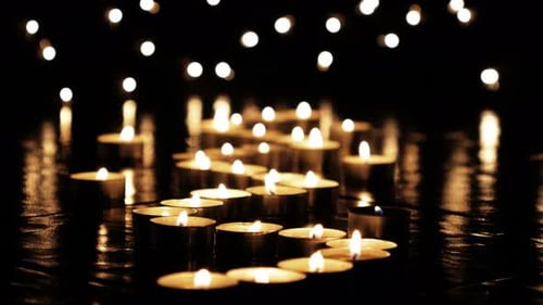 Many Candles Glowing in the Dark