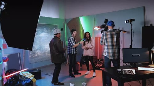 Filming Interview in Studio with Lights and Camera