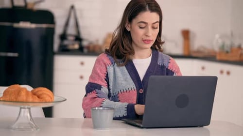 Businesswoman Works at Home