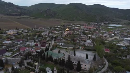 Small Cozy Town in the Mountains Shooting with a Drone
