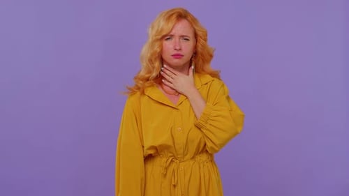 Woman Coughing and Touching Her Throat