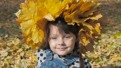 Adorable Girl with Autumn Leaves Crown