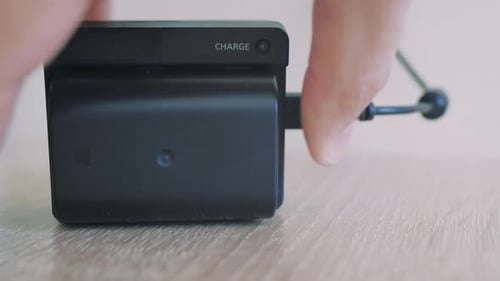 Inserting Battery into Charger with Green Light