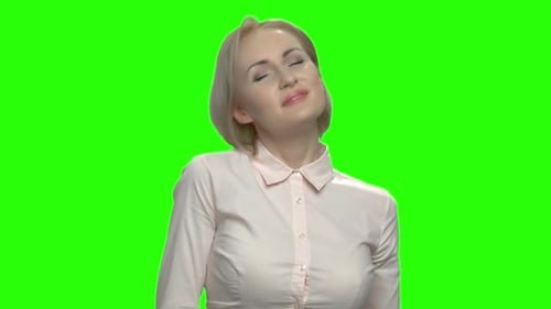 Smiling Woman Tilting Head on Green Screen