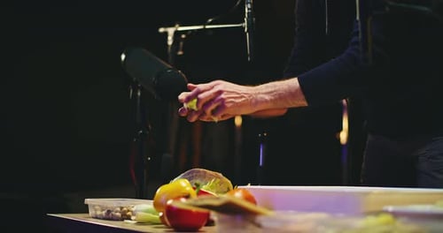 Crop Sound Designer Tearing Cabbage Leaves Near Microphone