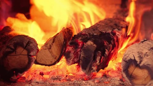 Firewood in oven and fireplace wood. Burning fire, firewood in fireplace