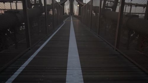SLOW MOTION: Empty Brooklyn Bridge with No People Early Morning at Sunrise in Beautiful Sunlight in