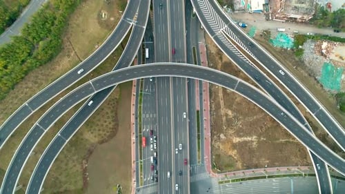 Top View to the Cars Driving on Multilevel Highway on the Sunset