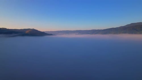 4K Aerial view of Mountains landscape with morning fog.
