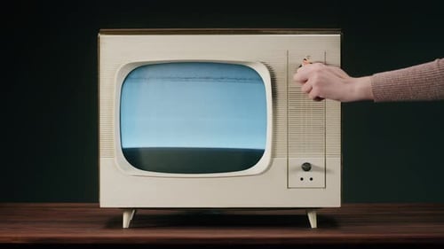 Vintage Television Flickers Before Displaying Static