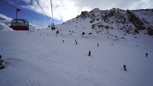 Skiers on a Snow Covered Mountain in Winter