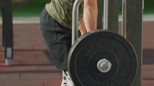 Tilt up view of a man lifting weights