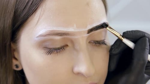Close-up of a Beautician at Work in a Salon