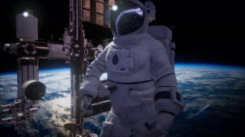 International Space Station and Astronaut in Outer Space Over the Planet Earth