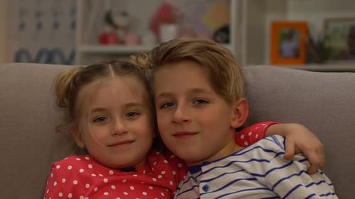 Happy Children Hugging Indoors