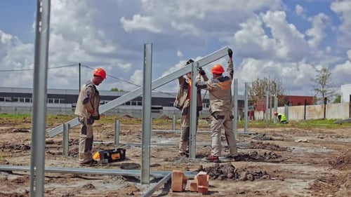 Working on construction site. Construction industry engineer standing orders for worker team
