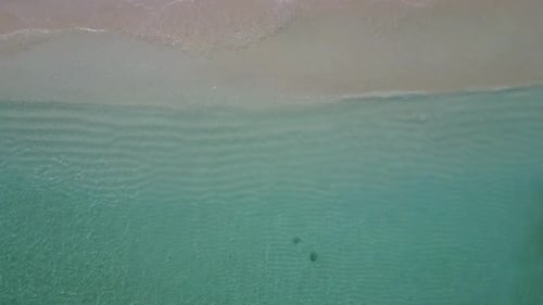 Drone texture of shore beach break by ocean with sand background