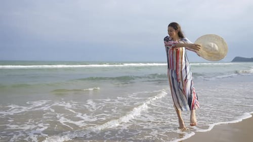 4K Portrait of Beautiful Caucasian woman walking on tropical beach in summer sunny day