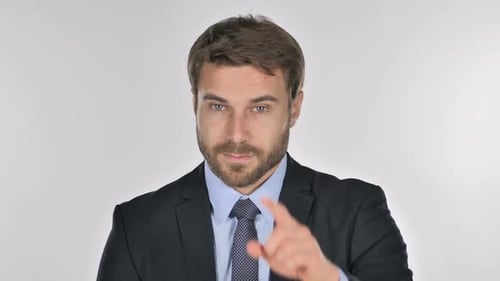 Man in Suit Points Directly at Camera