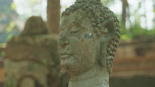4K Cinematic slow motion footage of ruins of Buddhist statues at Wat Umong Temple in Chiang Mai, Nor