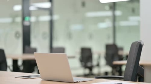 Middle Aged Businessman Coming Back and Starting Work on Laptop in Office
