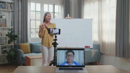 Woman Teaching Math Online to Student Remotely