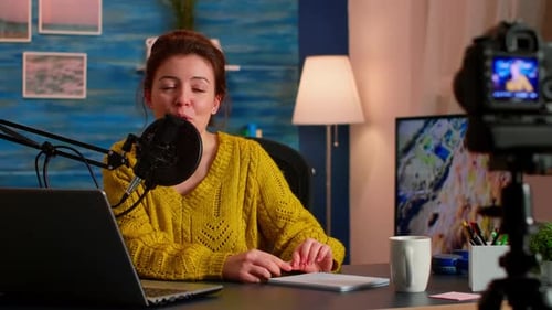 Woman Recording a Broadcast at Her Desk