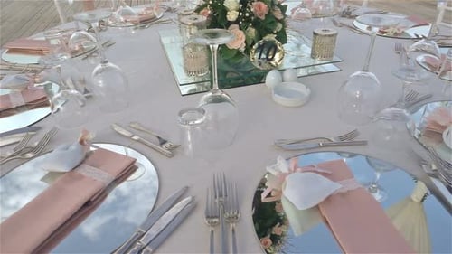 Elegant Wedding Table Setting with Pink Napkins