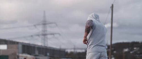 Man Jogging Outdoors in an Urban Environment