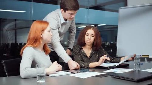 Team Discussing Data During Business Meeting