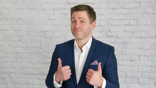 Man Giving Thumbs Up in Blue Blazer