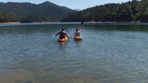 Couple kayaking on lake