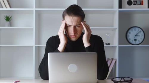 Stressed young adult feeling burnout from work