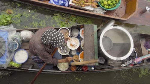 Damnoen Saduak Floating Market or Amphawa. Local people sell fruits, traditional food on boats
