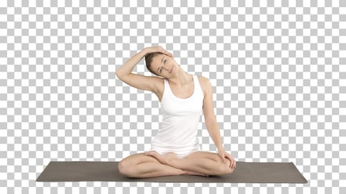 Young Woman Stretches Neck Doing Yoga Exercise