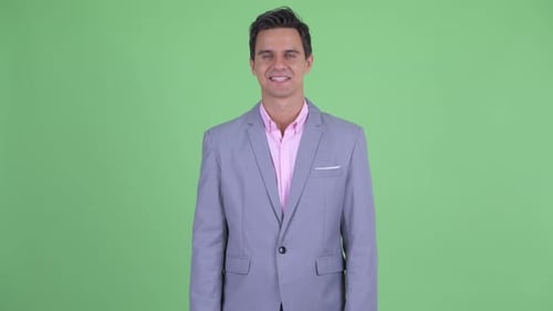 Smiling Man in Gray Suit Jacket