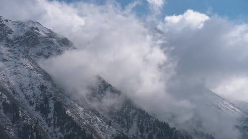 Mountain Peaks In The Clouds