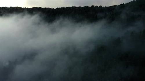 Aerial View of Low Hanging Clouds Over Mountains
