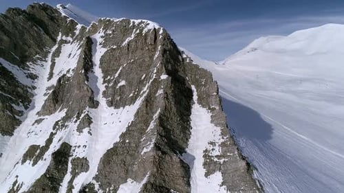Snowy Mountain Peak Aerial View in Winter