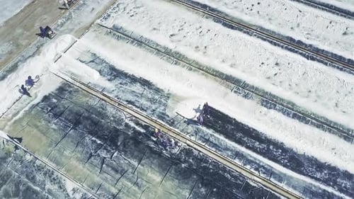 Workers Harvesting Salt on Rural Farm From Above
