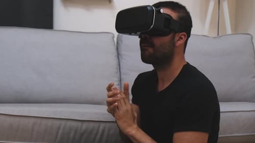 Man Experiences Virtual Reality in Living Room