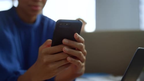 Business Woman Using Mobile Phone in Modern Office