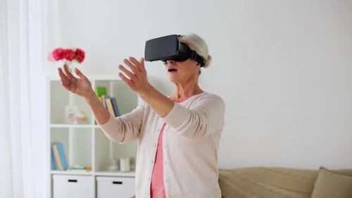 Senior Woman Experiencing Virtual Reality Technology Indoors