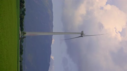 Wind Turbine Rotating in Rural Countryside Landscape